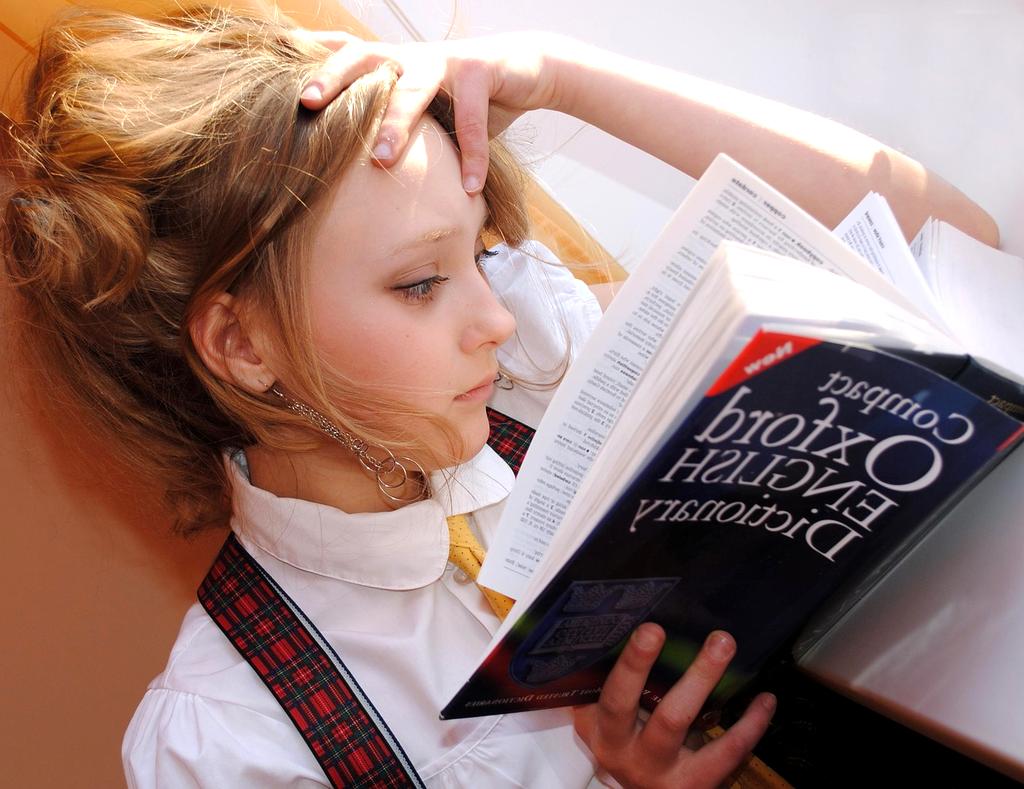 Open book and notes representing curriculum